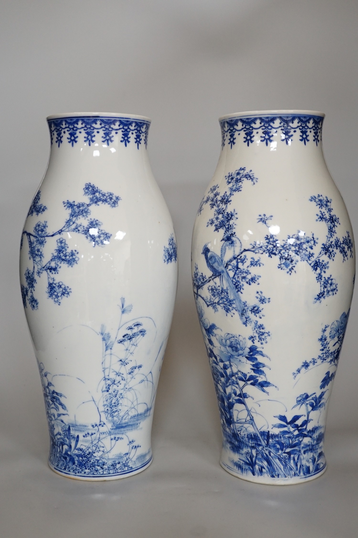 A pair of Japanese blue and white vases, 37cm high